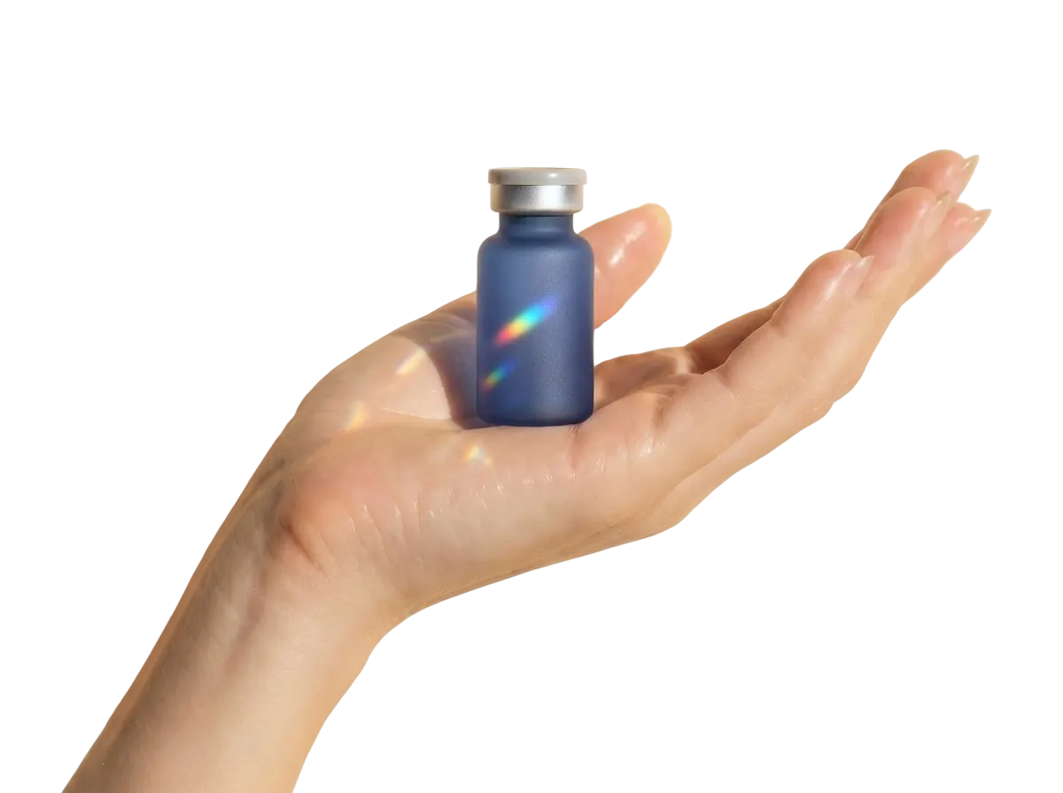 A hand holding a vial of OrderlyCares medication